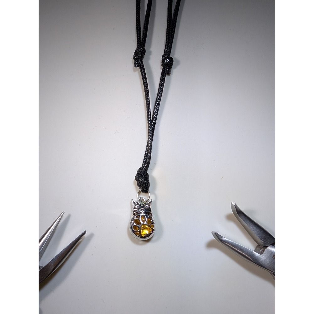 Cat Paw Pendant Necklace Silver Tone Amber Color Adjustable Black Cord Jewelry